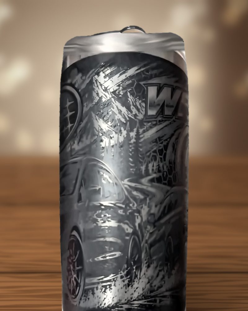 Black tumbler laser-engraved with WRX lettering, dirt spray and the side of a rally car